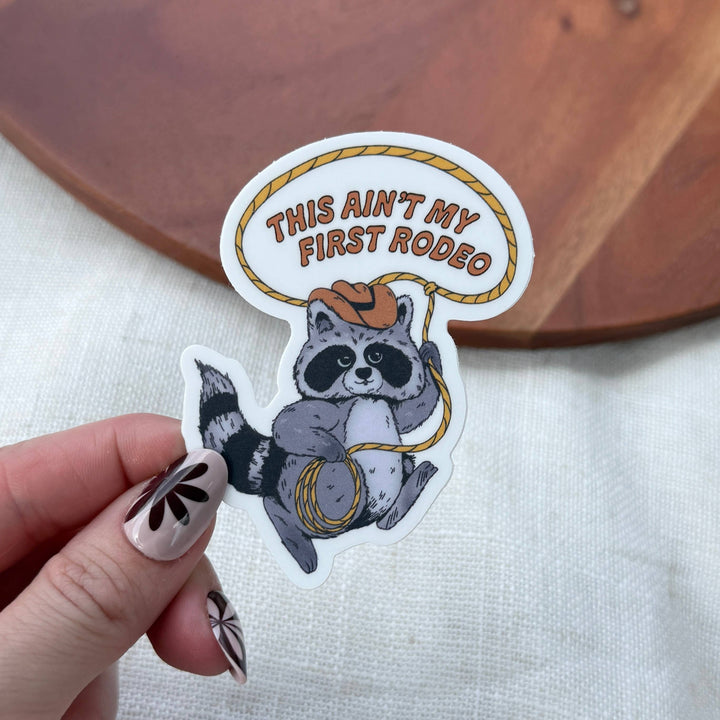 This Ain't My First Rodeo Cowboy Raccoon Lasso Sticker
