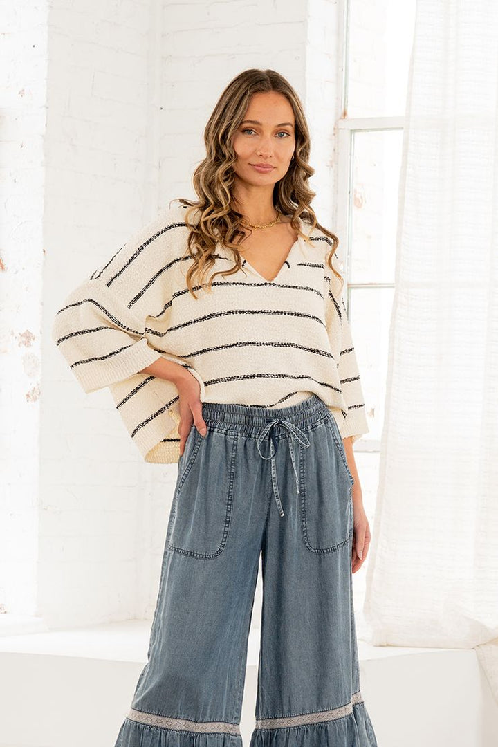 Classic Cream An Black Striped Sweater With a V Cut Neckline And Boxy Fit